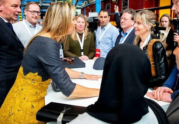 Queen Maxima's outfit is from the fashion house Natan. yellow lace skirt by Natan and grey top