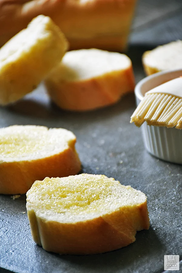 Butter the bread pieces