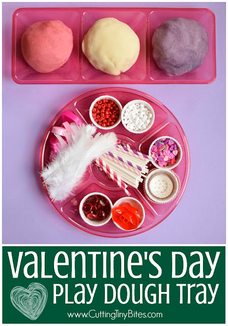Valentine's Day Play Dough Tray- add some simple props and accessories to soft, squishy play dough in Valentine's Day colors. What an easy way to keep toddlers, preschoolers, kindergartners, or elementary kids busy!
