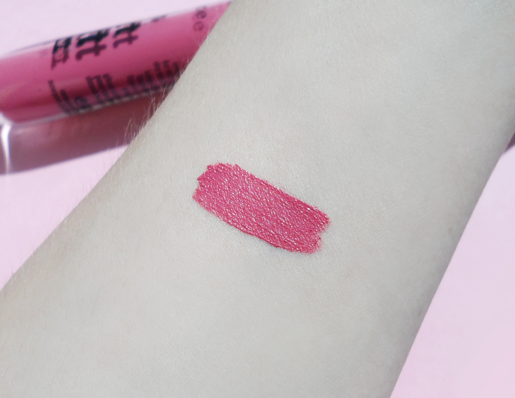 close-up of a light skin with a lipstick swatch on it