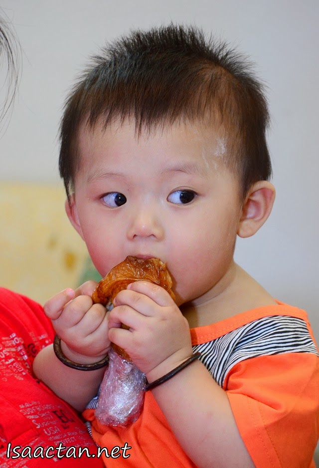 Baby Martin "enjoying" his chicken drumstick