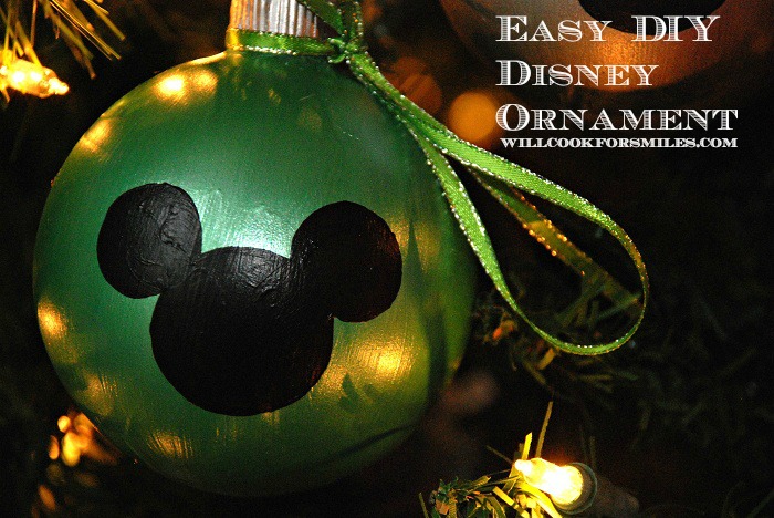 green mickey mouse ornament on a Christmas tree
