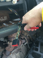 Cut the radio wiring harness from the van