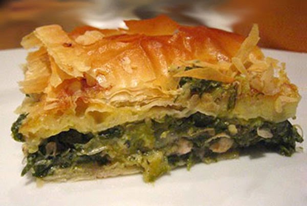 Spanakopita (Greek Spinach Phyllo Pastry Pie): A classic Greek vegetarian dish of wilted and chopped spinach greens mixed with onion, leek and Feta cheese in an egg base baked in a filo (phyllo) pasty shell and served just warm.