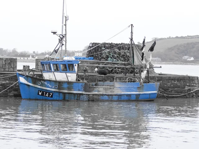 Blue fishing boat in Youghal, County Cork spotted on a road trip in Ireland between Dublin and Kinsale