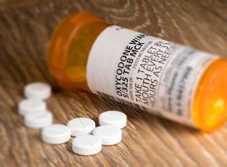 What are the possible side effects of Vicodin drug?