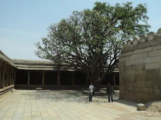 The three riders posing inside the Lepakshi temple courtyard