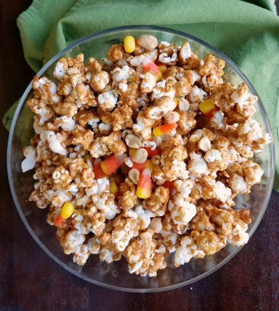 Sweet and salty crunch peanut popcorn with candy corn and peanuts for a fun version of hillbilly hash. A favorite fall treat just got upgraded! bowlful of hillbilly hash popcorn