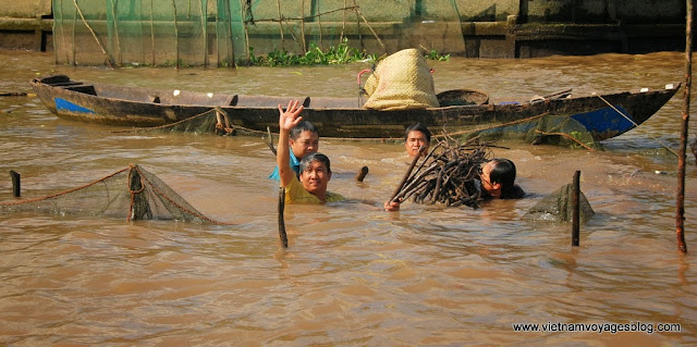 La vie quotidienne en marché flottant Cai Be - Photo An Bui