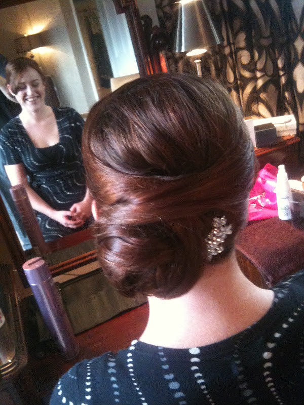The other bridesmaid went for a side bun hairstyle which looked ultra  title=