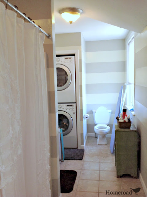 wide striped painted walls and washer and dryer