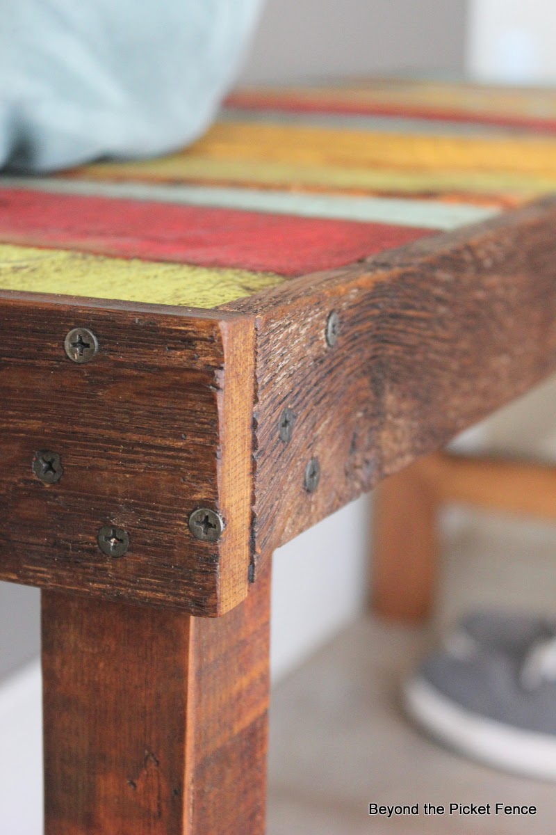 colorful rustic bench made with pallet wood and reclaimed wood http://bec4-beyondthepicketfence.blogspot.com/2014/04/colorful-rustic-bench.html
