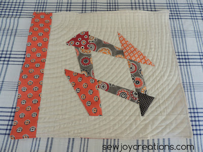 Liberated Churn Dash placemat with curve quilting