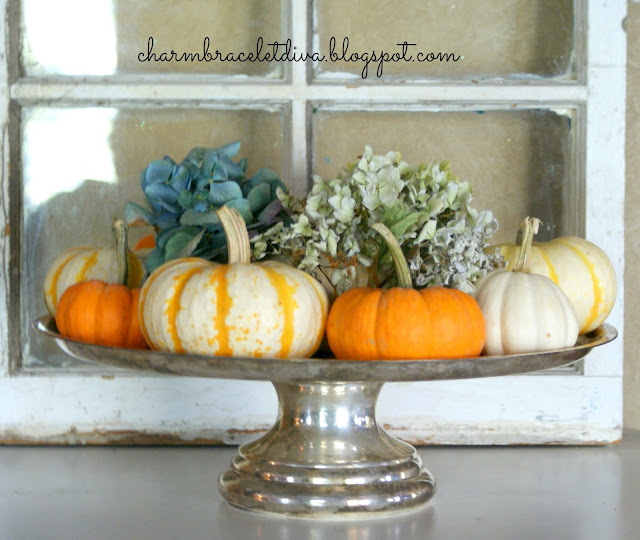 silver cake tray stand pumpkins hydrangeas