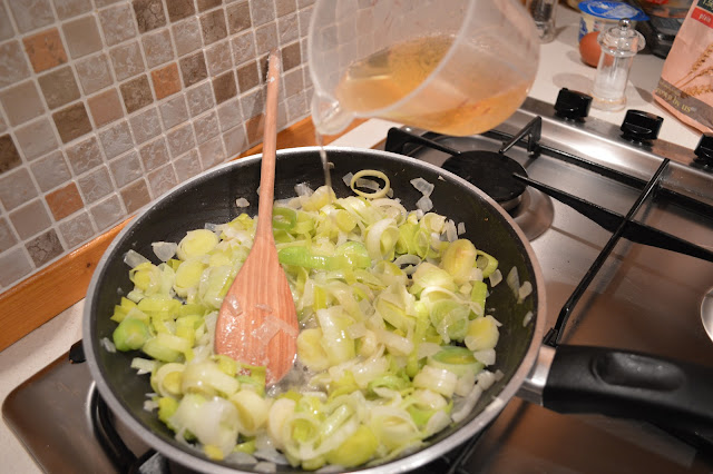 Leeks cooking with cider for Fish and Leek pie