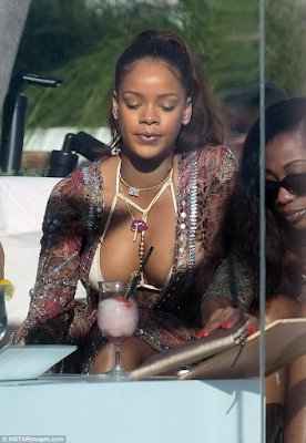 2 Rihanna flaunts her ample cleavage in skimpy bikini as she holidays in Miami