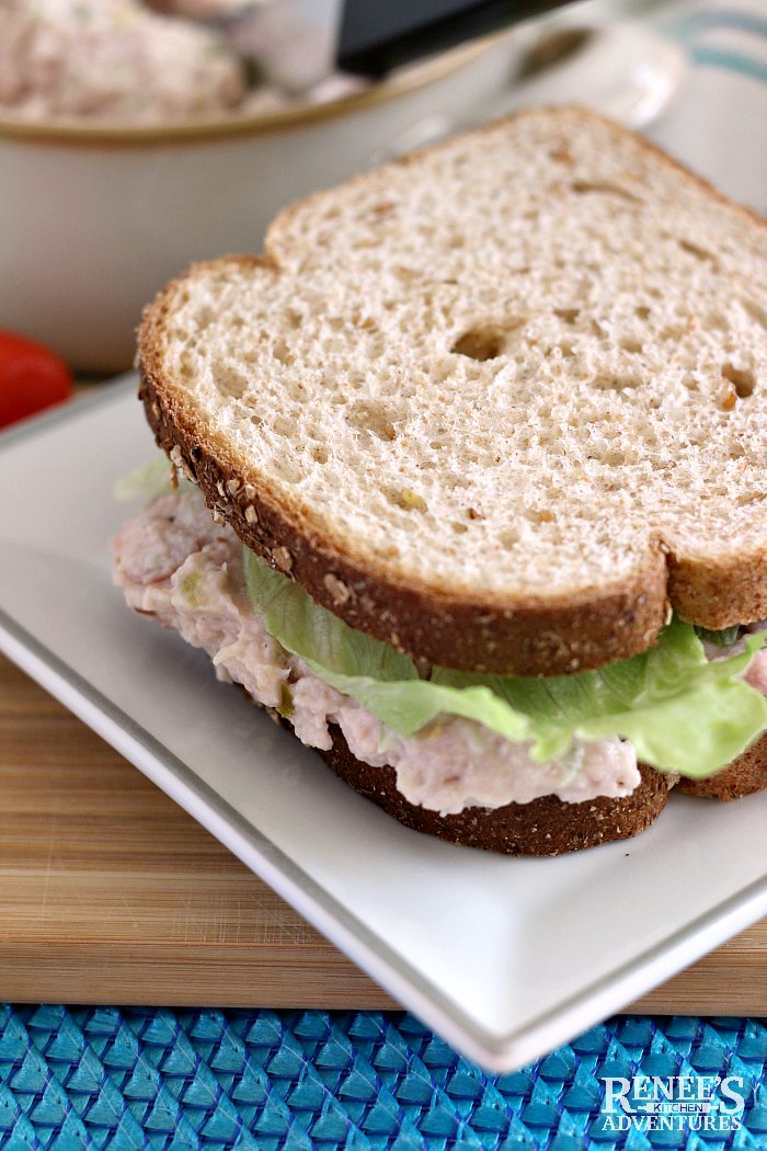 Favorite Ham Salad Recipe by Renee's Kitchen Adventures on a whole wheat bread sandwich with lettuce on a white plate