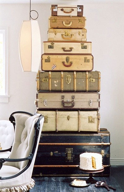 This stack of vintage suitcases adds a vintage flare to the bedroom. 