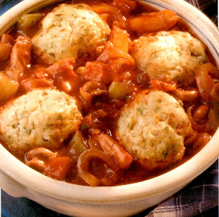 Chicken hotpot with dumplings: Chicken in a spaghetti sauce base with mushrooms served topped with flour dumplings