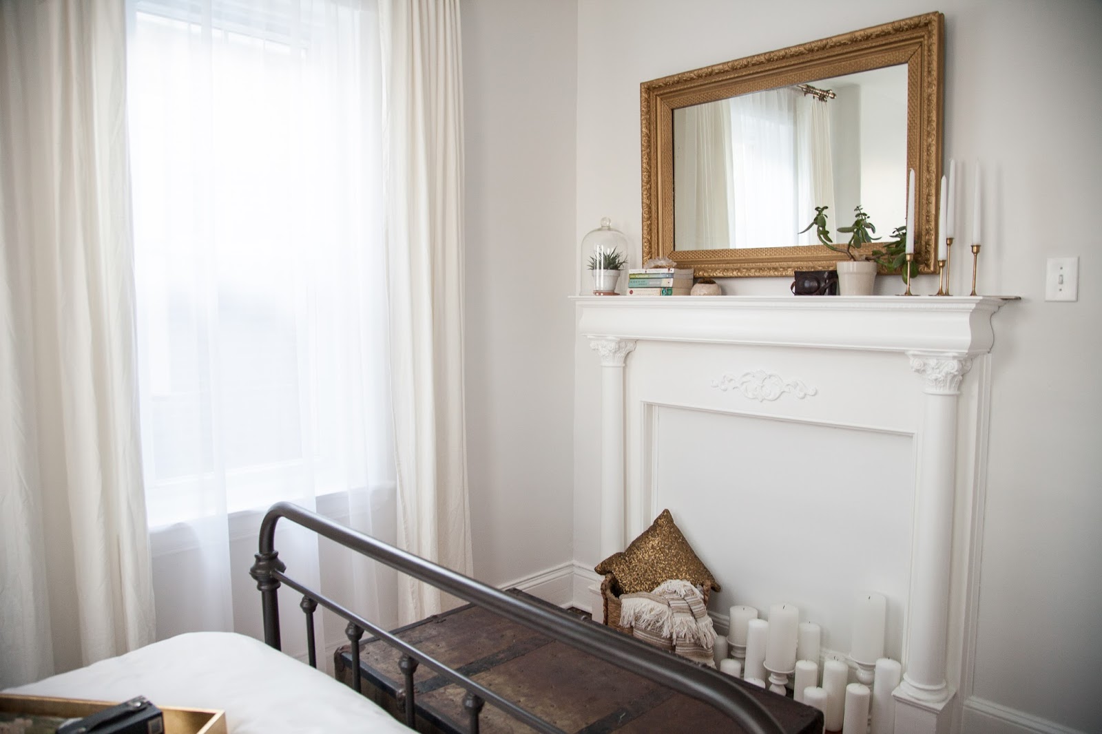 Guest Room with Vintage Mantel and Gold Mirror