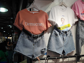 "Democrazy" and "Help Me!" shirts