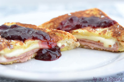 Deluxe French Toast Sandwiches are thinly sliced ham and mozzarella cheese stuffed between 2 pieces of french toast and topped it off with raspberry jam. Life-in-the-Lofthouse.com