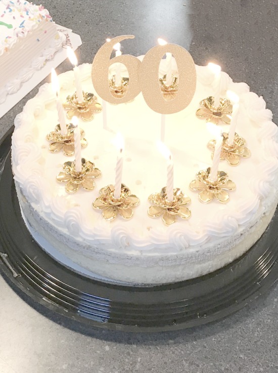 Cake with 60 and lit candles