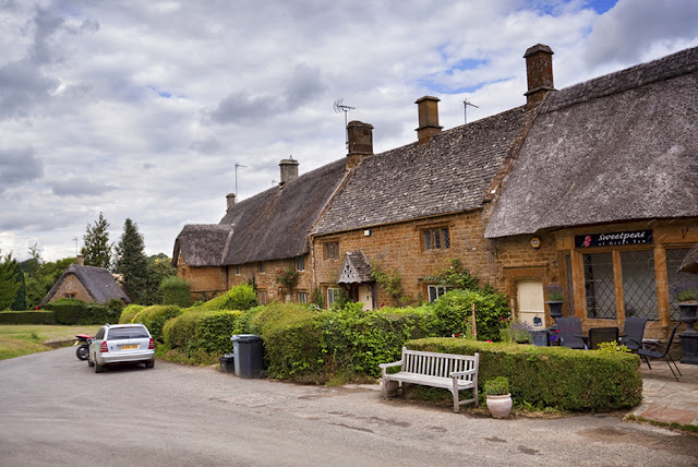 Iron Stone thatched cottages in the village of Great Tew by  Martyn Ferry Photography
