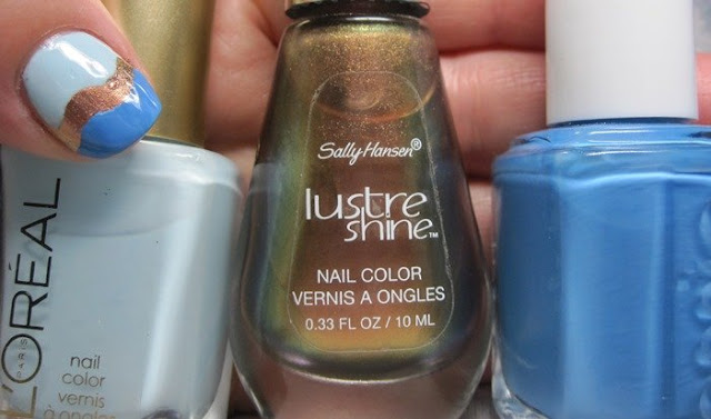 bottle shot:  L'Oreal Royally Yours, Sally Hansen Firefly, and Essie Avenue Maintain