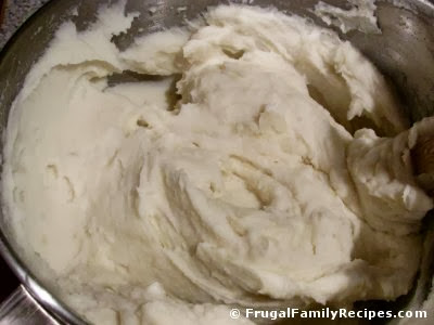creamy mashed potatoes in mixing bowl