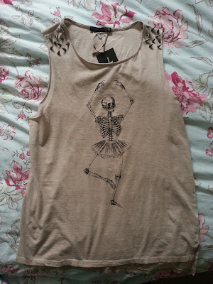 A picture of a skeleton ballerina spiked top