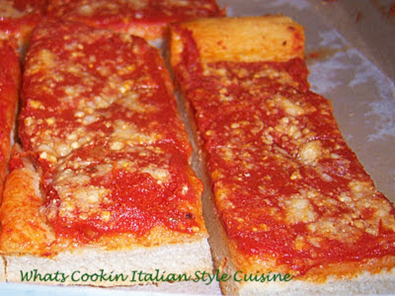 Tomato Pie Recipe from Upstate Utica New York is a pizza dough that is risen high, cooked with tomato sauce and grated cheese without mozzarella. It is well known in Utica, Rome and in the upstate new york area. It is like a bread with sauce and romano cheese on it