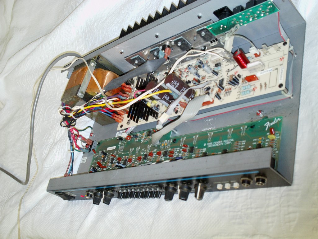 I removed the pcbs from the metal chassis and noticed that there were some  burnt areas on the pcb and many broken solder joints.