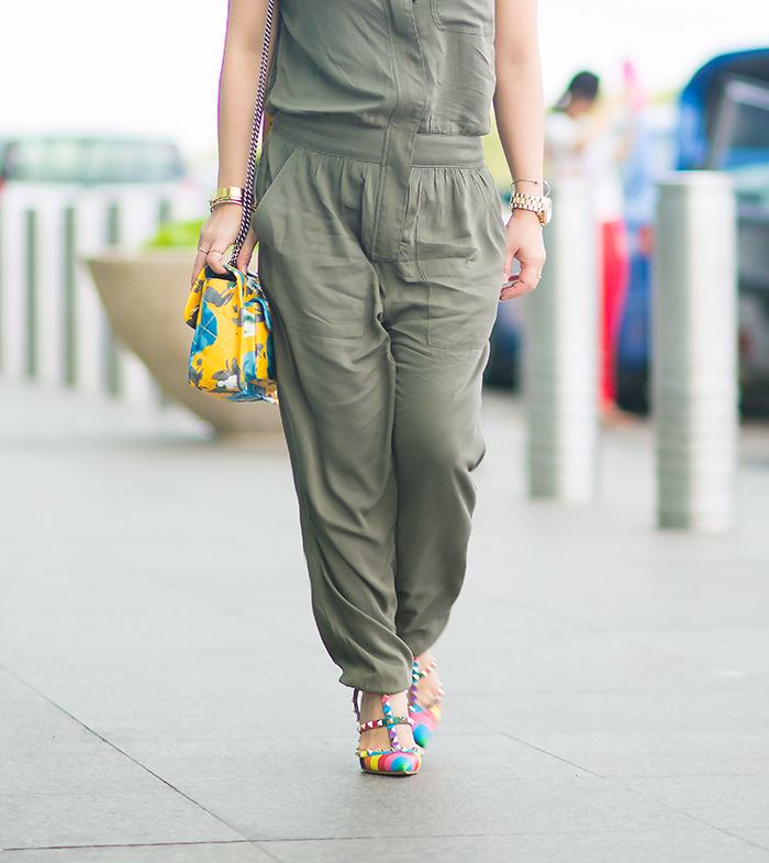 Crystal Phuong head to the airport in a green jumpsuit and heels. 