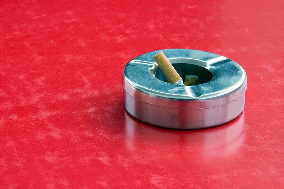ashtray on red table