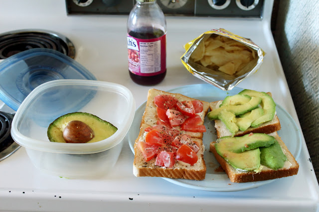 An image of my sandwiches with chips and a drink