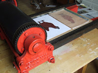 Linocut hens on press Linocut hens on press