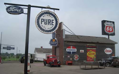 Pure gas sign and other old gasoline signs on an old gas station