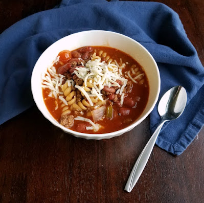 This is the chili soup we grew up with. It is simple, kid friendly and yummy! bowl of chili mac ready to eat