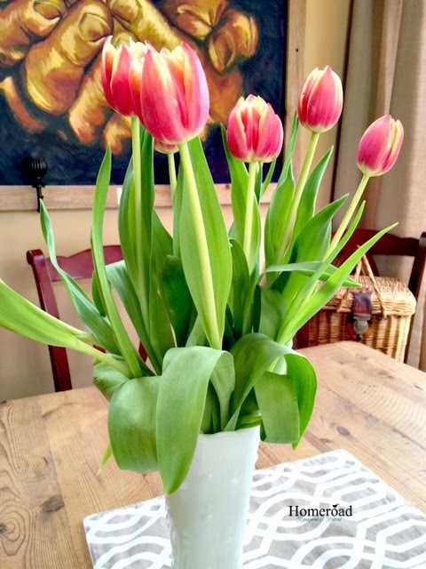 Red tulips in a vase on the table