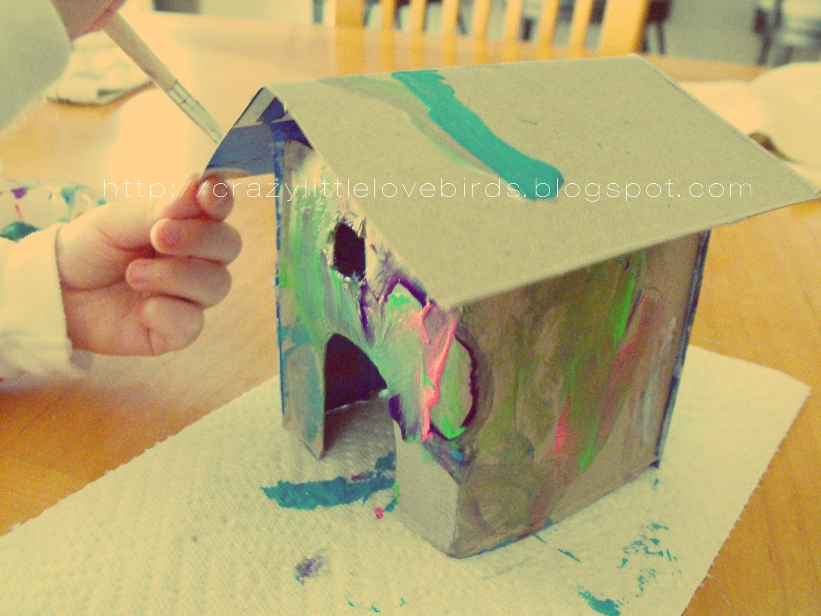 Painted cardboard houses and baked goodies