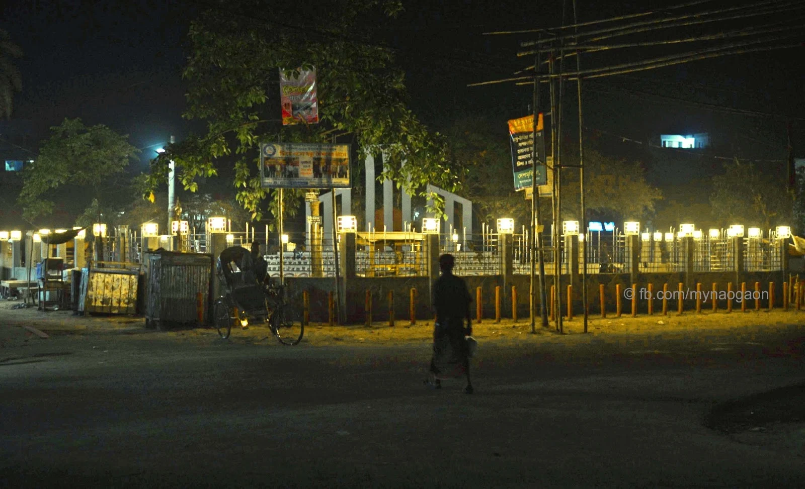 Night view of Naogaon Kendriyo Shahid Minar at Muktir Mor.