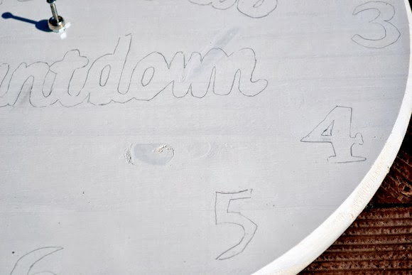 Tracing the clock numbers helps give you an easy template to follow when painting your clock