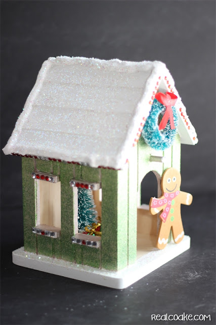 A DIY Christmas Craft to make a cute wood Gingerbread House from realcoake.com