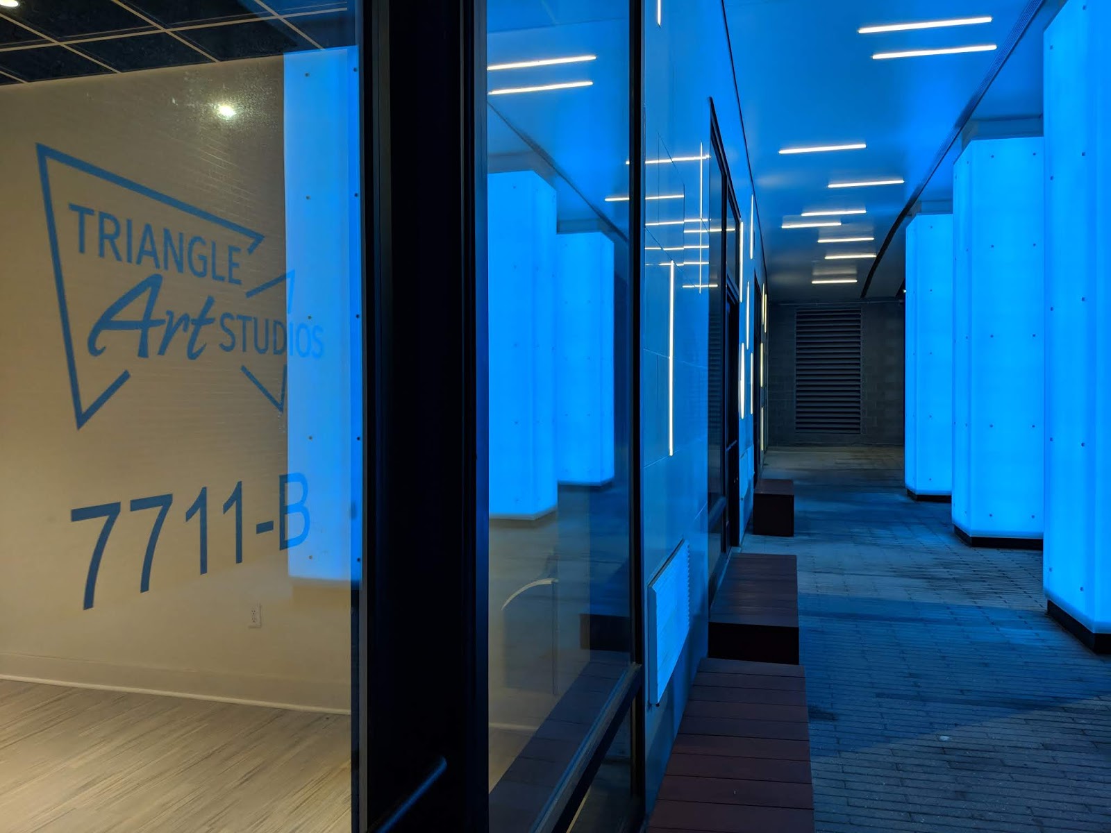 Robert Dyer Bethesda Row Triangle Art Studios signage appears at the