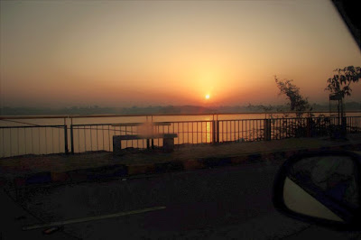 "The rising sun on the horizon,Taken from the highway while driving towards Kheda"
