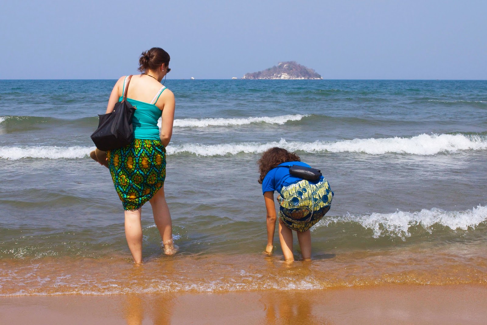 lake malawi swimming salima beach women girls testing water 