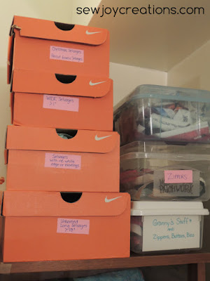 selvages stored in orange shoe boxes