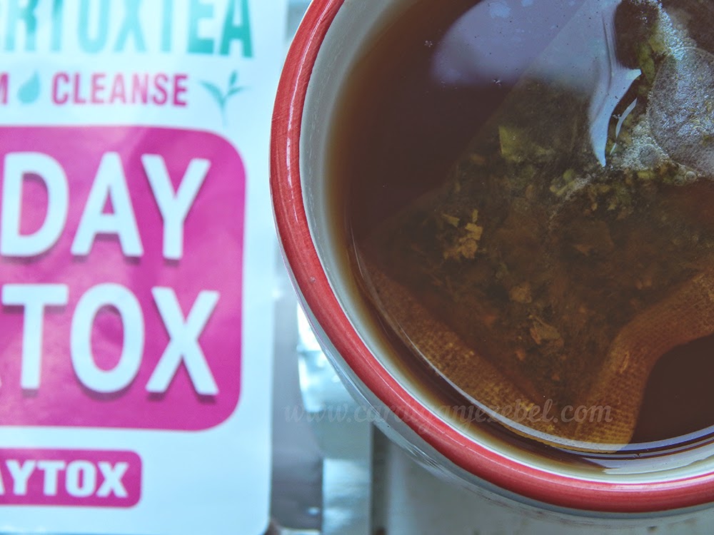 daytox tea floating in mug brewing