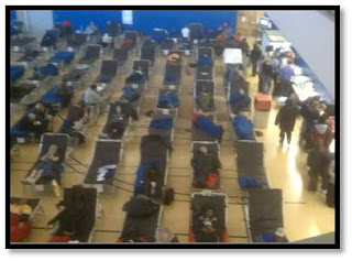 A gymnasium at Lehman College serves as a makeshift shelter for displaced residents